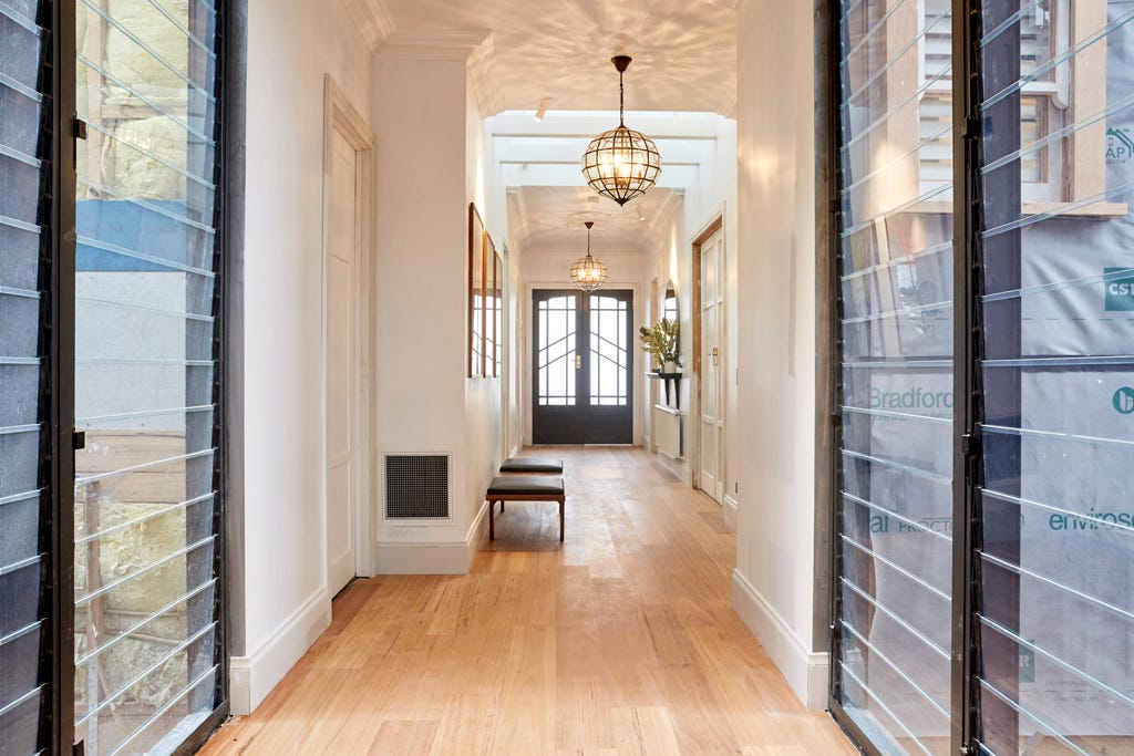 The two glass pendants, which married perfectly with the glass front doors, giving the hallway a sense of grand luxe