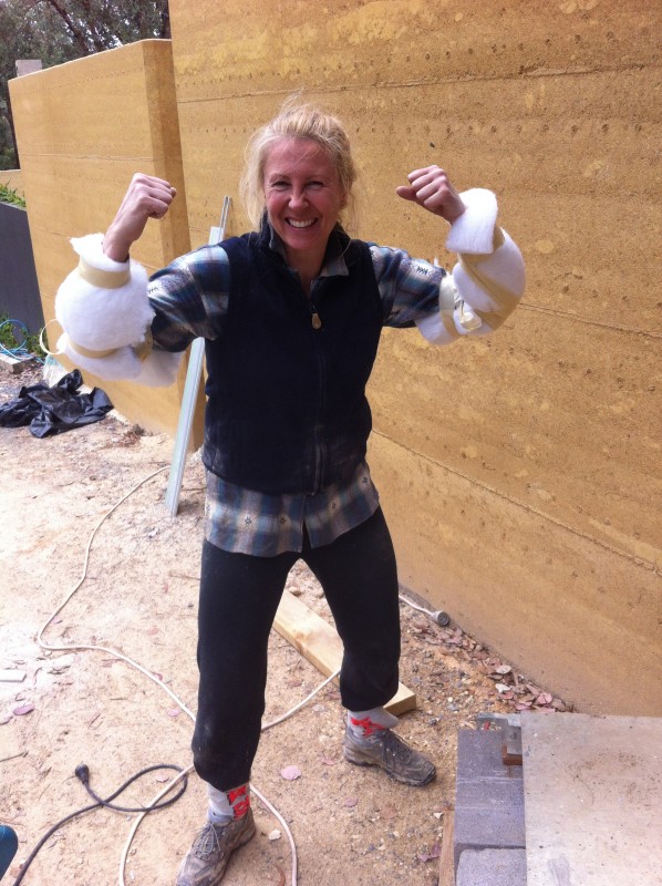  Kerrie has showed she's always happy to get involved and do some of the hard labour. Here she is prepping to install underfloor insulation. Love those arm guards, Kerrie!  