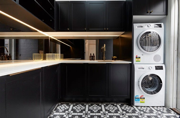 Jason and Sarah used black cabinetry, caesarstone and gorgeous mosaic black and white floor tiles to dress the room, with lovely smokey mirrors as feature details, all creating a real sense of luxury