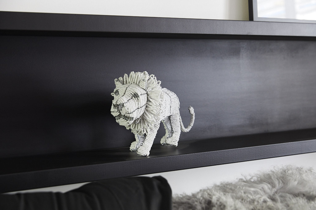 This beautifully hand beaded lion from South Africa is a unique work of art as seen in Kerrie and Spence's challenge apartment guest bedroom. 