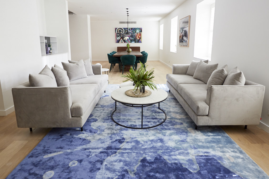  'Aqueous Rug' by Katie McKinnon as seen in Courtney and Hans' living room. 