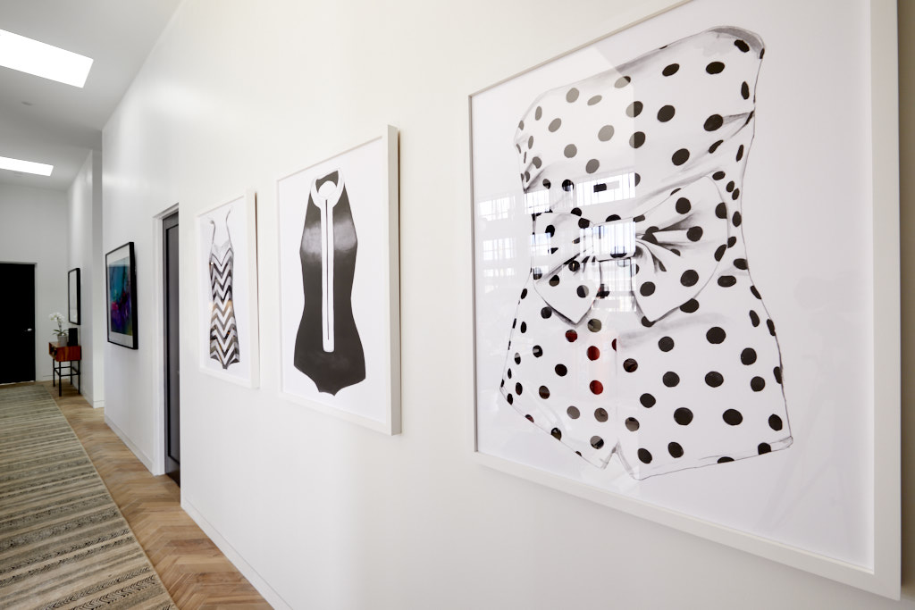  The three detailed black and white watercolour illustrations of vintage inspired bathing suits sit pretty in Bianca and Carla's hallway which Shaynna described as 